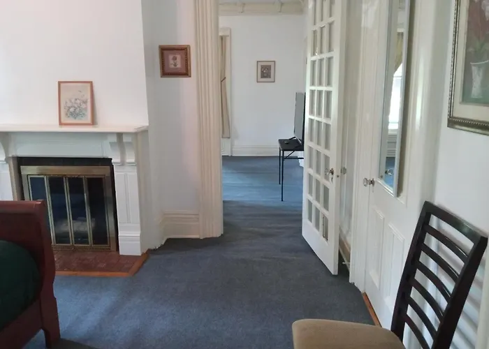 Mini Mansion Hotel Near Public Transportation Is The Yellow And Green House On The Corner Of 8Th St And Madison Avenue