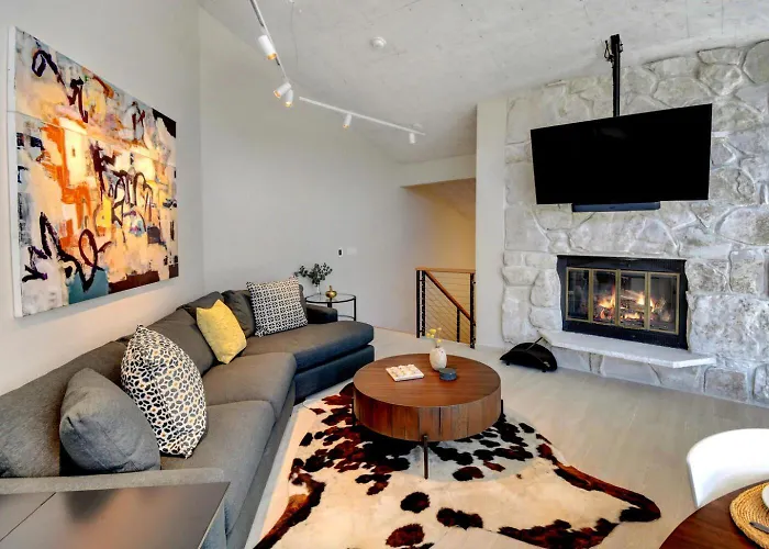 Riverfront Ski Retreat: Luxury Condo with Hot Tub & Activity Perks