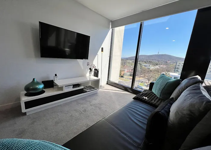 Midnight Luxe: Urban Braddon Apartment with Skyline Views