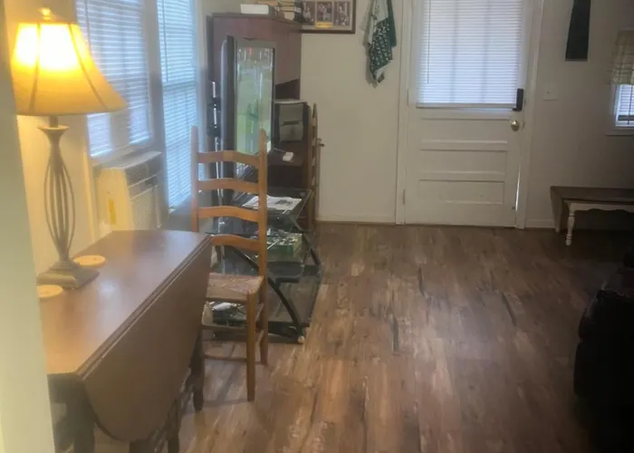 The Clubhouse Masters Golf Themed 1 King Bed 1 Bath Furnished Apartment Full Size Kitchen Full Size Leather Pull Out Sleeper Sofa In Living Room & Full Size Leather Sofa 1 Gig Fiber Internet Directv Premium Package All Sports & Movie Channels & Dvr