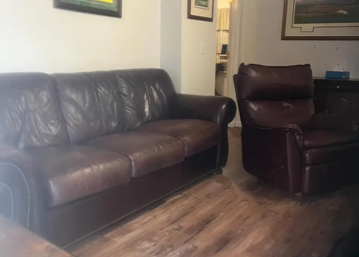 The Clubhouse Masters Golf Themed 1 King Bed 1 Bath Furnished Apartment Full Size Kitchen Full Size Leather Pull Out Sleeper Sofa In Living Room & Full Size Leather Sofa 1 Gig Fiber Internet Directv Premium Package All Sports & Movie Channels & Dvr
