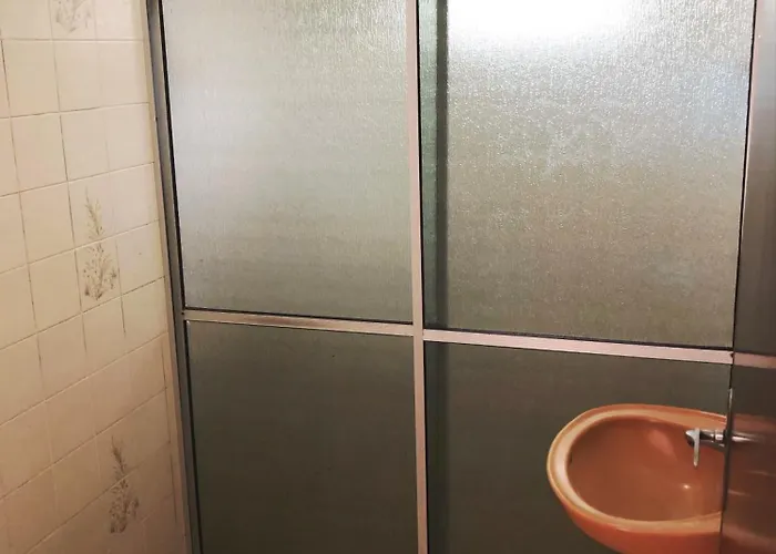 Quartos a 50 metros da praia