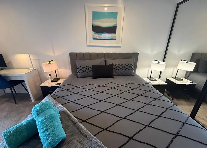 Midnight Luxe: Urban Braddon Apartment with Skyline Views