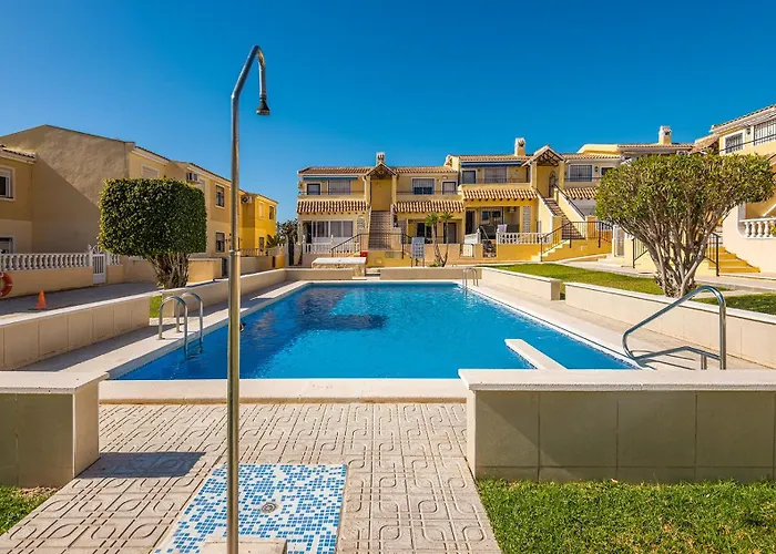 Stylish Poolside Retreat Near Villamartin Plaza - Casa Fre