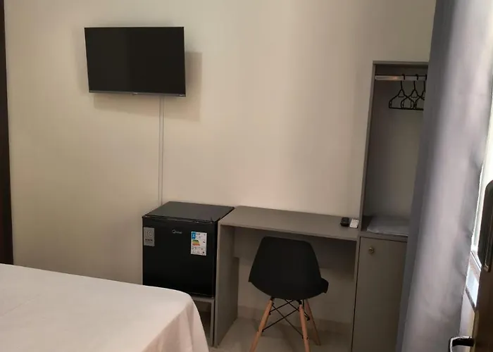 Quarto com ar banheiro frigobar