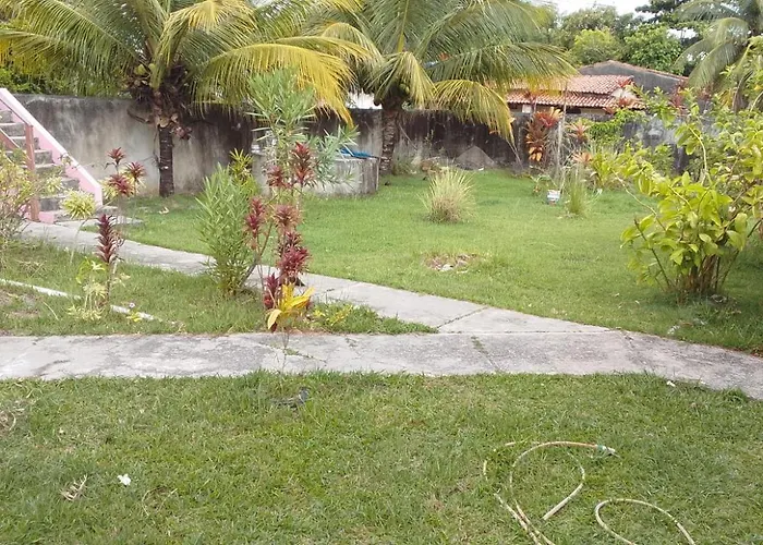 Casa Rosa da Ilha - Suíte Confortável com Ventilador e Jardim