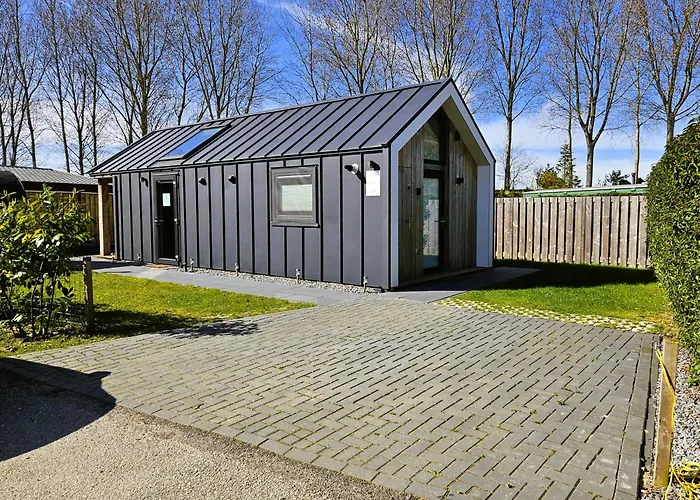 Tiny Zen House in Heinkenszand with private sauna, airco, outdoor swimming pool, WiFi&2 bedrooms