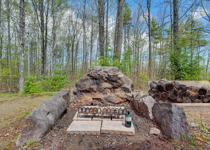 Fire Pit & Forest Views: Lakes Region Retreat