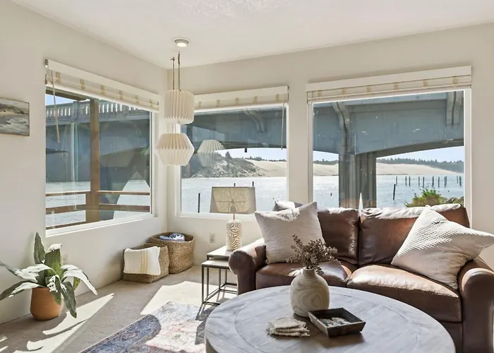 Incredible Riverfront Oasis With Wraparound Deck & Cozy Interior